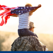 military soldier or veteran with a child on his shoulders holding an American flag