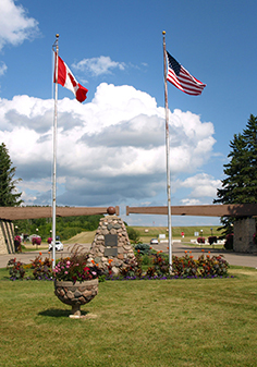 Photo of USA and Canada flags at the Peace Garden Gates