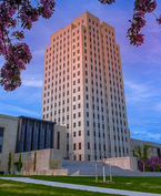 Cherry blossoms framing the North Dakota State Capitol Complex
