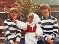 Old photo of First Lady Armstrong with her brothers when they were 5-10 years old, dressed in Norwegian outfits