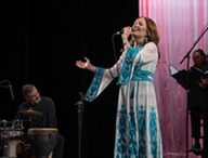 Jordanian vocalist Farah Siraj performing the last World Fest residency and final concert in Minot, ND, alongside the community choir