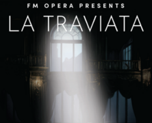 A poster for the opera "La Traviata" by FM Opera, with a figure in white standing in a spotlight among scattered red petals.
