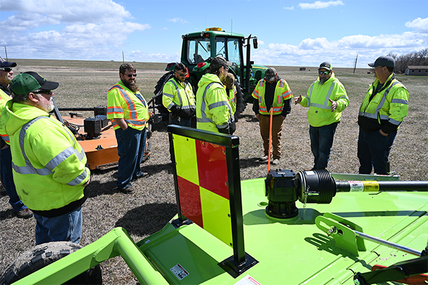 Maintenance employees learn about equipment and safety in the field
