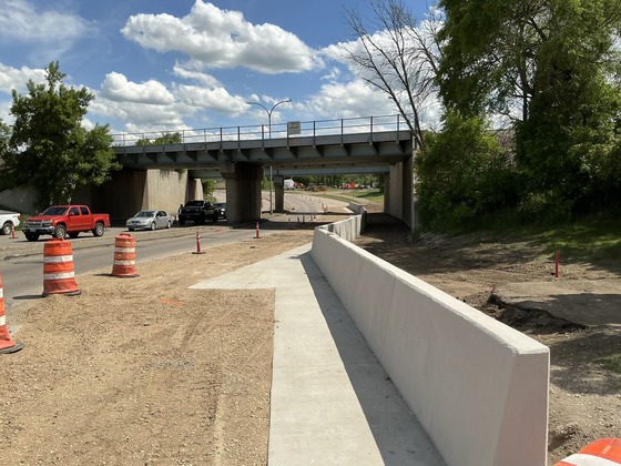 Newly completed concrete barrier wall along the railroad underpass on Memorial Highway near Main Street in Mandan.