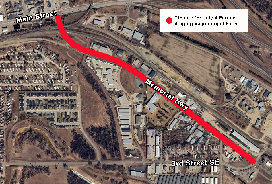 Road closure sign on West Memorial Highway in Mandan, ND, for the Fourth of July parade.