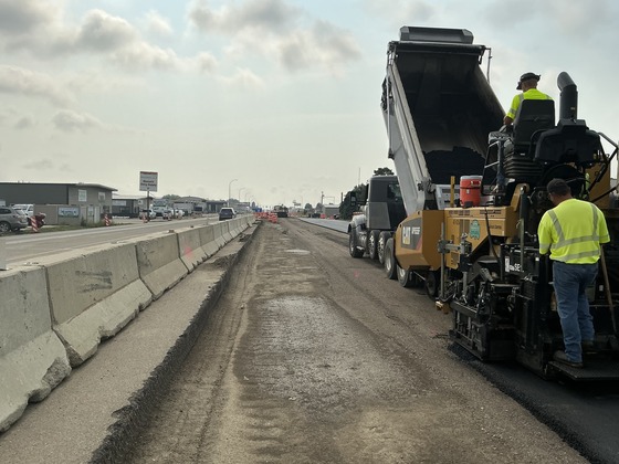 Photo of crews paving at the Memorial Highway Phase 2 project in Mandan, North Dakota.
