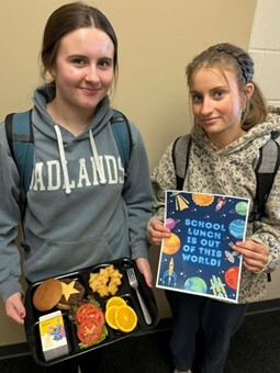 West Fargo students holding a lunch tray