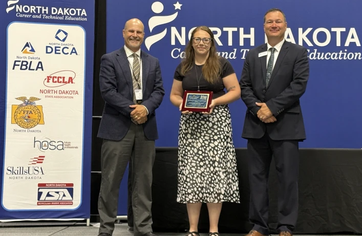 Hannah Freese pictured with Eric Ripley (left), executive director of CTE for Grand Forks Public Schools, and Wade Sick, ND CTE state director.