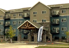 apartment building with open house sign