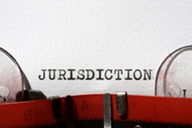 Typewriter typing the word jurisdiction