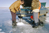 Ice fishing on Lake Sakakawea, N.D., 1974. Click to go to https://digitalhorizonsonline.org/digital/collection/p16921coll1/id/8473/