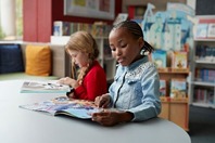 Kids reading at a table