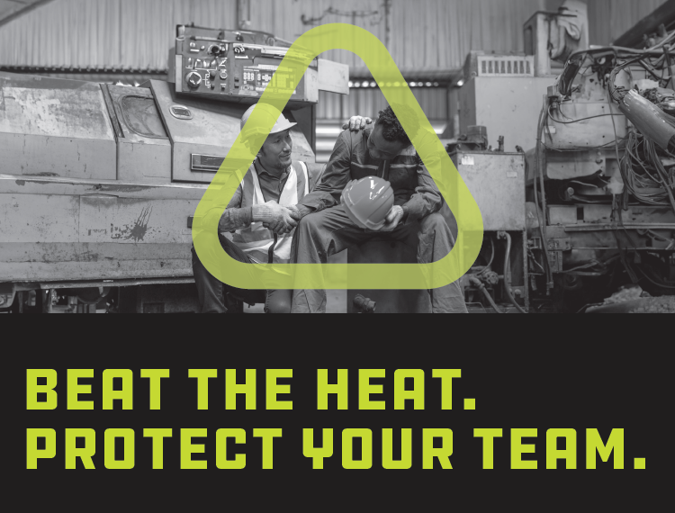 Black and white photo of man sitting down with his head down while a coworker in a hard hat holds onto his hand in support.