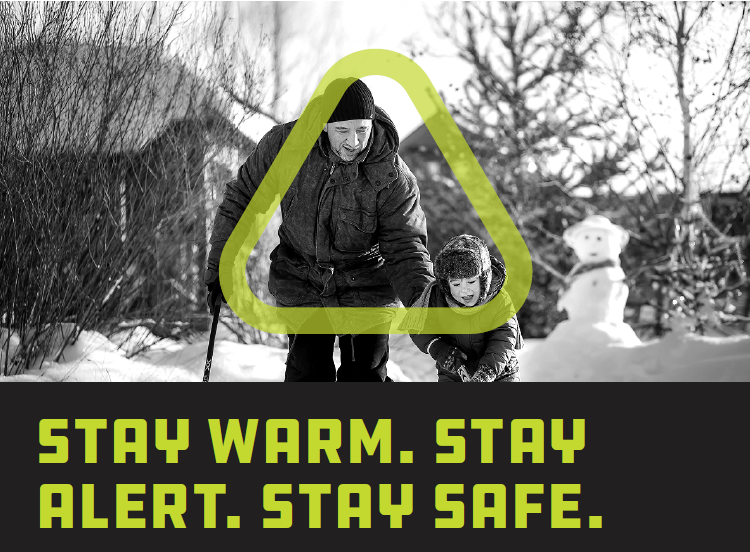 Adult and child play hockey together on a frozen outdoor rink