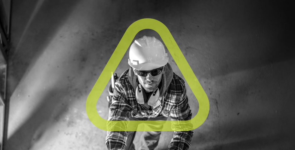 Man climbing ladder wearing hard hat, ear protection, and sunglasses