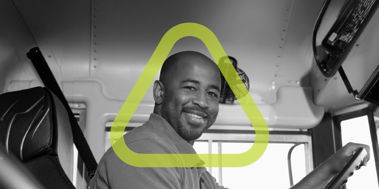 Male bus driver smiling and looking at camera