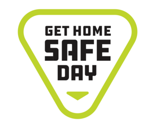 Get Home Safe Day logo with those words inside upside down green triangle 