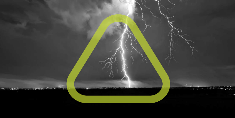 Forked bolt of lightning striking a city in the distance with the Get Home Safe triangle surrounding the bolt.