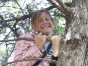 Girl climbing a tree.