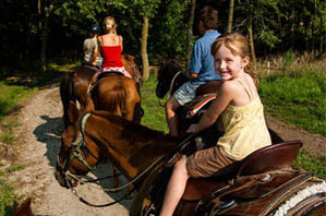 Girl on a horseback trail ride.
