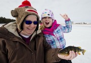 Mother and daughter ice fishing.