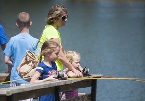 Mom and kids fishing.