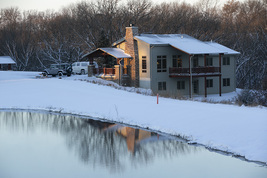 State park cabin in the winter by a lake
