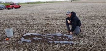 Agustin working on calibration of a manure spreader at an on-farm study site (Source: Amy Schmidt)