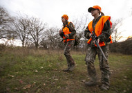 Man and woman deer hunting