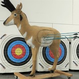 A 3-D archery target with arrows in it