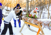 People cutting the yule log during Winterfest at Ponca