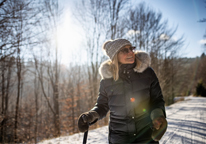 Woman hiking in snowy woods