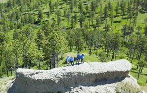 TV hosts standing on bluff at Chadron State Park