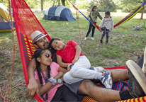 Father in a hammock with his kids at Louisville State Recreation Area