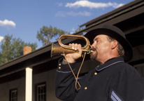 Fort Hartsuff reenactor using a bugle