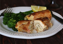 Prosciutto-wrapped northern pike on plate with broccoli