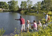 Group of anglers at Family Fishing Night practicing fishing