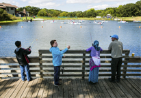 Kids fishing from the dock at the Missouri River Expo