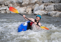 A kayaker navigating rapids at Kearney's new whitewater park