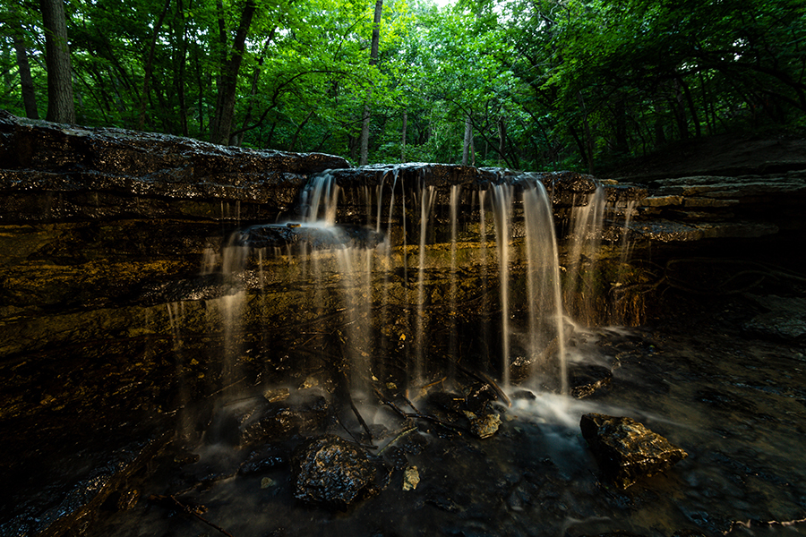 Stone Creek Falls at Platte River State Park at night.