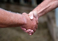 Landowner and hunter shaking hands