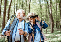 Senior couple bird watching with binoculars