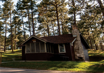 A Nebraska state park cabin in wooded area