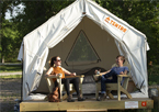 Couple sitting in front of Tentrr campsite