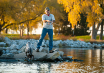 Man fishing at a Nebraska state park in fall