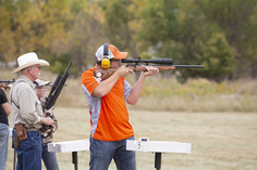 Boy participating in a shooting competition