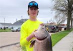 Isaac Howser with state record bigmouth buffalo fish, at 63 pounds