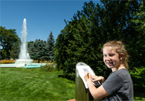 Girl standing at Great Park Pursuit post