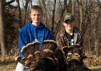 Two boys with harvested turkey