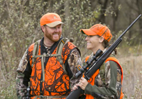 Deer hunters smiling and talking together